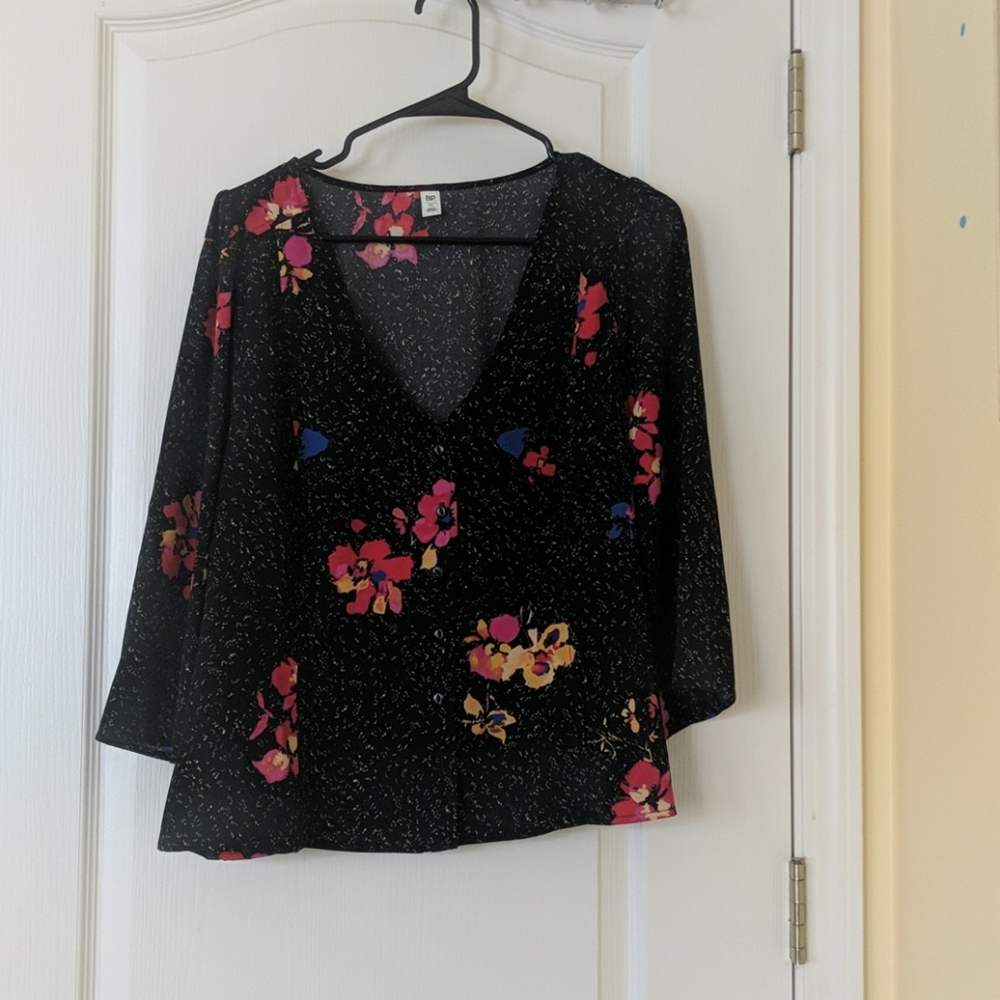 Patterned blouse button up front.
